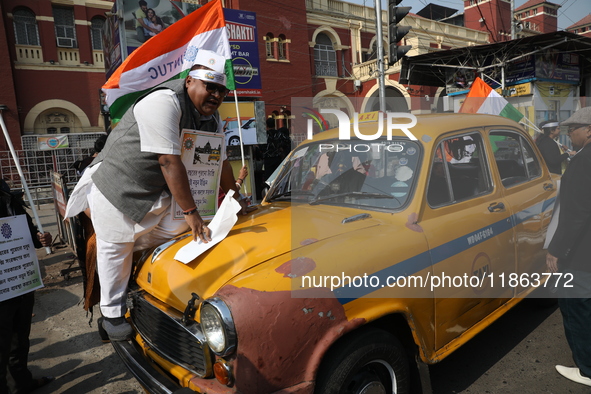 Supporters of the Indian National Congress take part in a protest against the Calcutta High Court's 2008 order that no commercial vehicle ol...