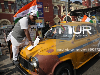 Supporters of the Indian National Congress take part in a protest against the Calcutta High Court's 2008 order that no commercial vehicle ol...