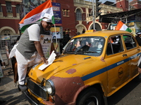 Supporters of the Indian National Congress take part in a protest against the Calcutta High Court's 2008 order that no commercial vehicle ol...