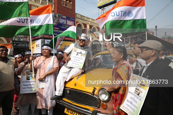 Supporters of the Indian National Congress take part in a protest against the Calcutta High Court's 2008 order that no commercial vehicle ol...