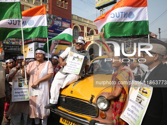 Supporters of the Indian National Congress take part in a protest against the Calcutta High Court's 2008 order that no commercial vehicle ol...