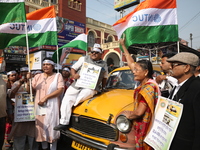 Supporters of the Indian National Congress take part in a protest against the Calcutta High Court's 2008 order that no commercial vehicle ol...