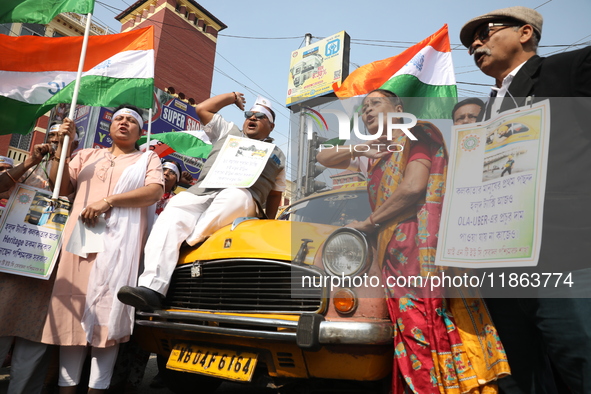 Supporters of the Indian National Congress take part in a protest against the Calcutta High Court's 2008 order that no commercial vehicle ol...