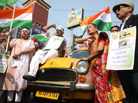 Supporters of the Indian National Congress take part in a protest against the Calcutta High Court's 2008 order that no commercial vehicle ol...