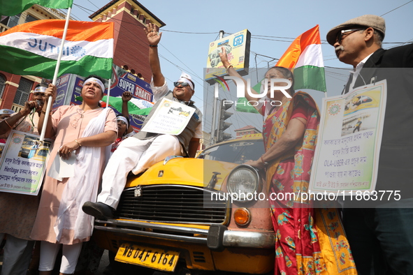 Supporters of the Indian National Congress take part in a protest against the Calcutta High Court's 2008 order that no commercial vehicle ol...