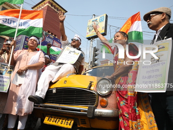 Supporters of the Indian National Congress take part in a protest against the Calcutta High Court's 2008 order that no commercial vehicle ol...