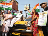 Supporters of the Indian National Congress take part in a protest against the Calcutta High Court's 2008 order that no commercial vehicle ol...