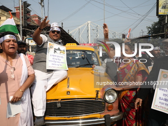 Supporters of the Indian National Congress take part in a protest against the Calcutta High Court's 2008 order that no commercial vehicle ol...