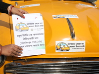 Supporters of the Indian National Congress take part in a protest against the Calcutta High Court's 2008 order that no commercial vehicle ol...