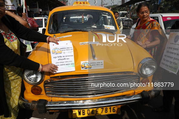 Supporters of the Indian National Congress take part in a protest against the Calcutta High Court's 2008 order that no commercial vehicle ol...