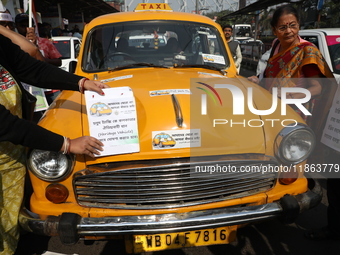 Supporters of the Indian National Congress take part in a protest against the Calcutta High Court's 2008 order that no commercial vehicle ol...