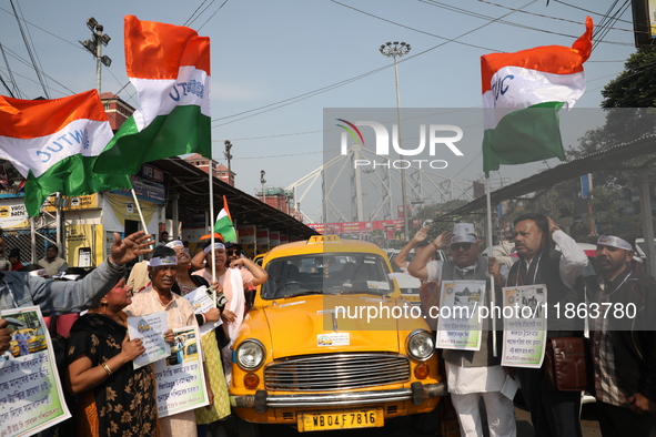 Supporters of the Indian National Congress take part in a protest against the Calcutta High Court's 2008 order that no commercial vehicle ol...