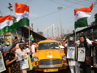 Supporters of the Indian National Congress take part in a protest against the Calcutta High Court's 2008 order that no commercial vehicle ol...