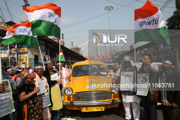 Supporters of the Indian National Congress take part in a protest against the Calcutta High Court's 2008 order that no commercial vehicle ol...