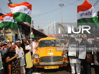 Supporters of the Indian National Congress take part in a protest against the Calcutta High Court's 2008 order that no commercial vehicle ol...