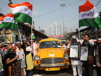 Supporters of the Indian National Congress take part in a protest against the Calcutta High Court's 2008 order that no commercial vehicle ol...