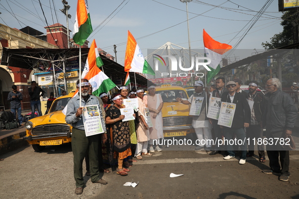 Supporters of the Indian National Congress take part in a protest against the Calcutta High Court's 2008 order that no commercial vehicle ol...