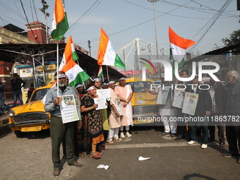 Supporters of the Indian National Congress take part in a protest against the Calcutta High Court's 2008 order that no commercial vehicle ol...