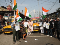 Supporters of the Indian National Congress take part in a protest against the Calcutta High Court's 2008 order that no commercial vehicle ol...