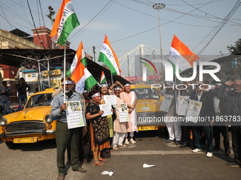 Supporters of the Indian National Congress take part in a protest against the Calcutta High Court's 2008 order that no commercial vehicle ol...