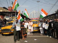 Supporters of the Indian National Congress take part in a protest against the Calcutta High Court's 2008 order that no commercial vehicle ol...