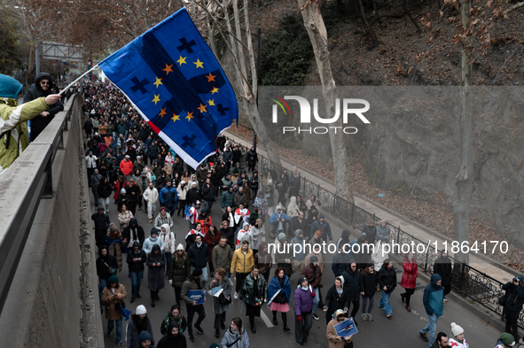 Private sector workers, students, and protesters take to the streets for a demonstration against the Georgian government's postponement of E...