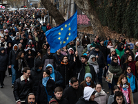 Private sector workers, students, and protesters take to the streets for a demonstration against the Georgian government's postponement of E...