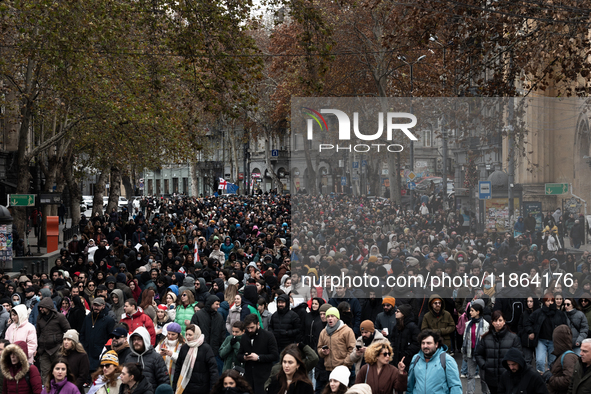 Private sector workers, students, and protesters take to the streets for a demonstration against the Georgian government's postponement of E...