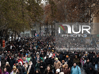 Private sector workers, students, and protesters take to the streets for a demonstration against the Georgian government's postponement of E...