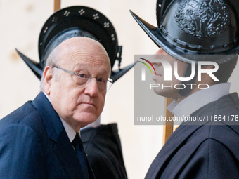 Lebanon's Prime Minister Najib Mikati arrives at the St. Damaso courtyard for a private audience with Pope Francis at the Vatican on Decembe...