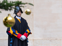 A member of the Swiss Guard walks across the San Damaso courtyard during the arrival of Lebanon's Prime Minister Najib Mikati in Vatican Cit...