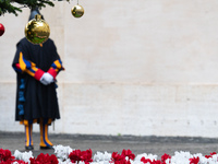 A member of the Swiss Guard walks across the San Damaso courtyard during the arrival of Lebanon's Prime Minister Najib Mikati in Vatican Cit...