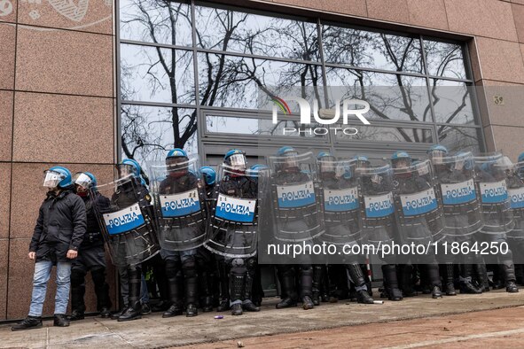 During a student march, a clash occurs in front of the Polytechnic University in Turin, Italy, on December 13, 2024. The students attempt to...