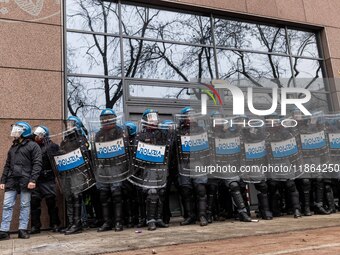 During a student march, a clash occurs in front of the Polytechnic University in Turin, Italy, on December 13, 2024. The students attempt to...