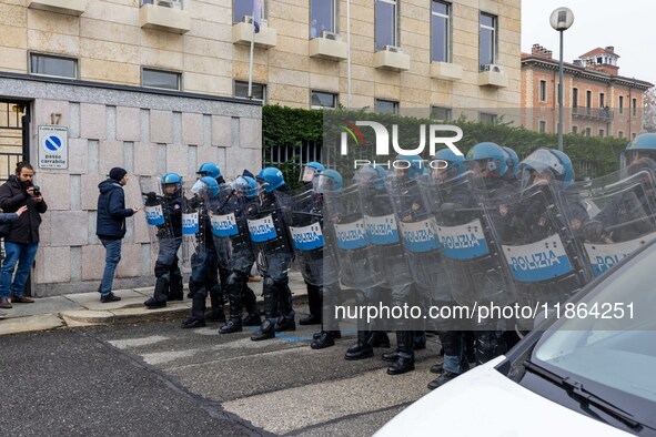 During a student march, a clash occurs in front of the Polytechnic University in Turin, Italy, on December 13, 2024. The students attempt to...