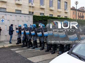 During a student march, a clash occurs in front of the Polytechnic University in Turin, Italy, on December 13, 2024. The students attempt to...