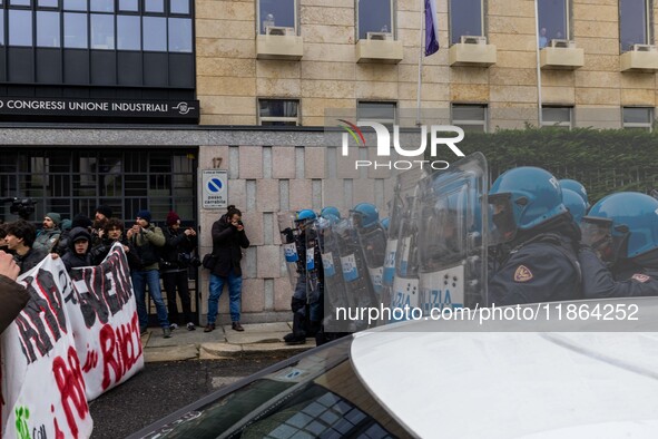 During a student march, a clash occurs in front of the Polytechnic University in Turin, Italy, on December 13, 2024. The students attempt to...