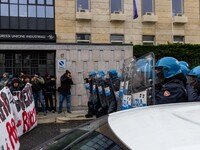 During a student march, a clash occurs in front of the Polytechnic University in Turin, Italy, on December 13, 2024. The students attempt to...