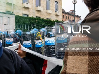 During a student march, a clash occurs in front of the Polytechnic University in Turin, Italy, on December 13, 2024. The students attempt to...