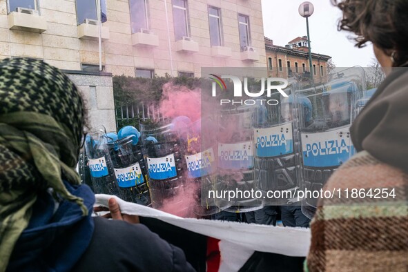 During a student march, a clash occurs in front of the Polytechnic University in Turin, Italy, on December 13, 2024. The students attempt to...