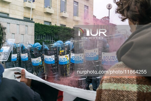 During a student march, a clash occurs in front of the Polytechnic University in Turin, Italy, on December 13, 2024. The students attempt to...