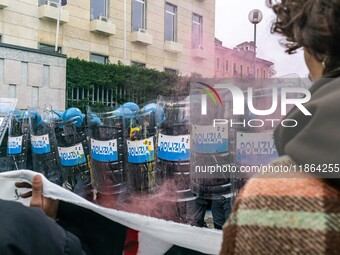 During a student march, a clash occurs in front of the Polytechnic University in Turin, Italy, on December 13, 2024. The students attempt to...