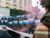 During a student march, a clash occurs in front of the Polytechnic University in Turin, Italy, on December 13, 2024. The students attempt to...