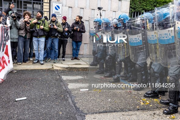 During a student march, a clash occurs in front of the Polytechnic University in Turin, Italy, on December 13, 2024. The students attempt to...