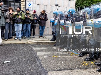 During a student march, a clash occurs in front of the Polytechnic University in Turin, Italy, on December 13, 2024. The students attempt to...