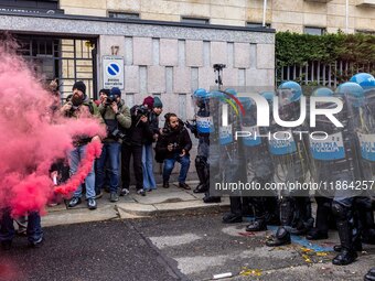 During a student march, a clash occurs in front of the Polytechnic University in Turin, Italy, on December 13, 2024. The students attempt to...