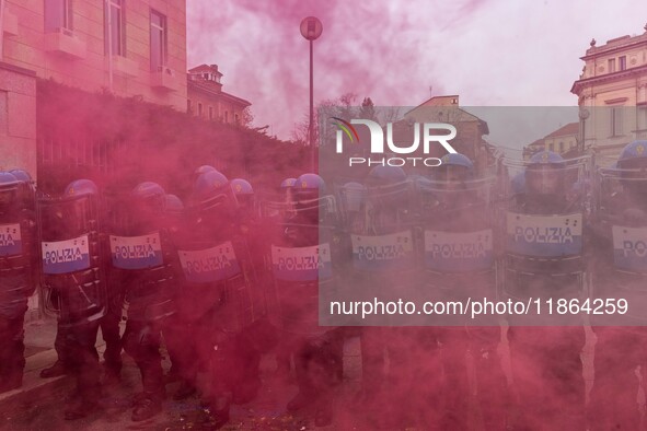 During a student march, a clash occurs in front of the Polytechnic University in Turin, Italy, on December 13, 2024. The students attempt to...