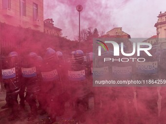 During a student march, a clash occurs in front of the Polytechnic University in Turin, Italy, on December 13, 2024. The students attempt to...