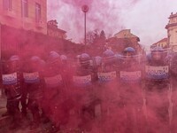 During a student march, a clash occurs in front of the Polytechnic University in Turin, Italy, on December 13, 2024. The students attempt to...