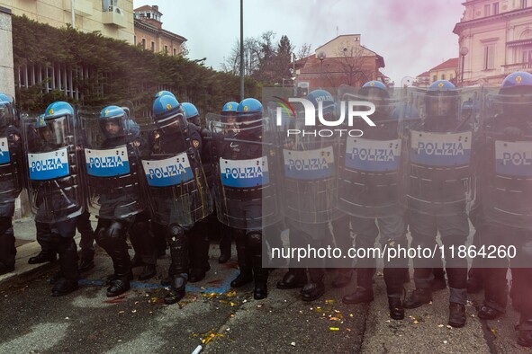 During a student march, a clash occurs in front of the Polytechnic University in Turin, Italy, on December 13, 2024. The students attempt to...